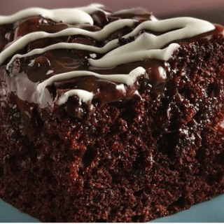 A Wonderful Chocolate Poke Cake With Chocolate Chips & Caramel