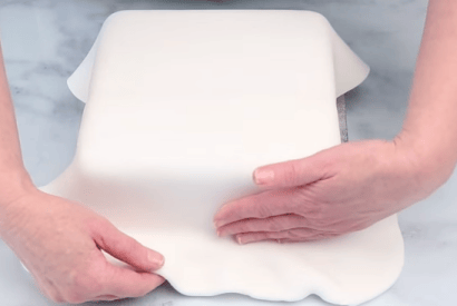 Thumbnail for How To… Cover A Square Cake In fondant Icing