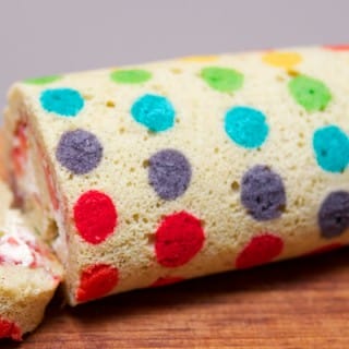 All the Colours Of The Rainbow Is This Fab Polka Dot Swiss Roll With A Cream , Jam And Fresh Fruit Filling