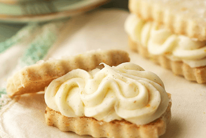 Thumbnail for Yummy Vanilla Bean Shortbread Sandwiches With Orange Buttercream