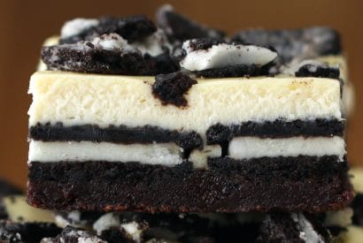 Thumbnail for Yummy Cookies & Cream Brownie Cheesecake Bars