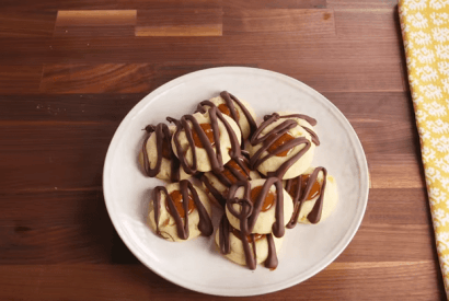 Thumbnail for Step By Step Guide To  Make These Delicious Holiday Twix Thumbprints