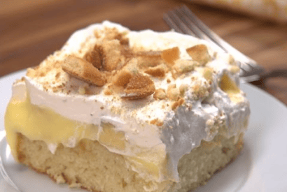 Thumbnail for This Banana Poke Cake Recipe Is Sure To Be A Hit